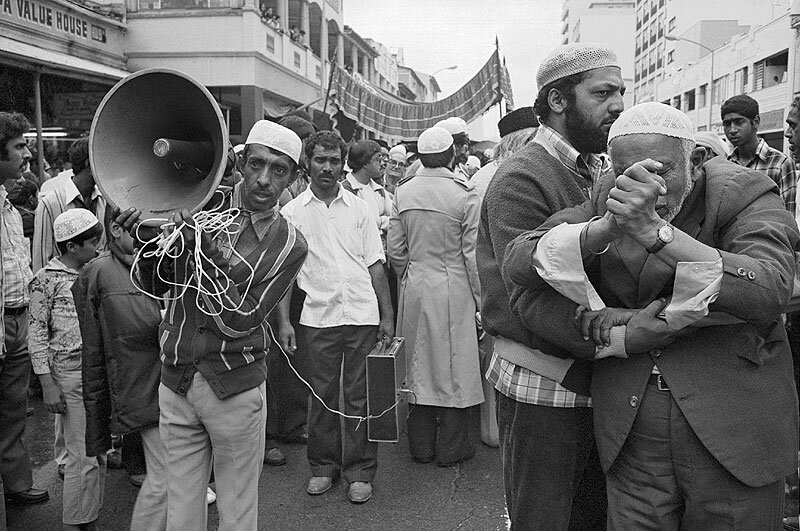 Man with loudspeakers. Badsha Pir birthday celebrations. Grey street. 1981
