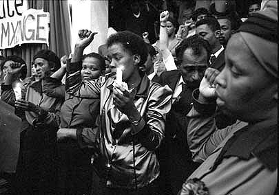 Nozizwe Madlala president of NOW and other executive members beside the coffin of slain NOW leader Victoria Mxenge. University of Natal. 1985