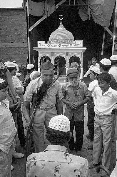 Devotee suffering from cancer being blessed. Muharram celebrations. Stratford road. 1984